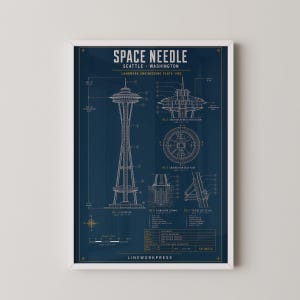 May include: A framed architectural blueprint poster of the Space Needle in Seattle, Washington. The dark blue print features white technical line drawings, including elevation, cross-section, and floor plan views with detailed labels and a scale bar.