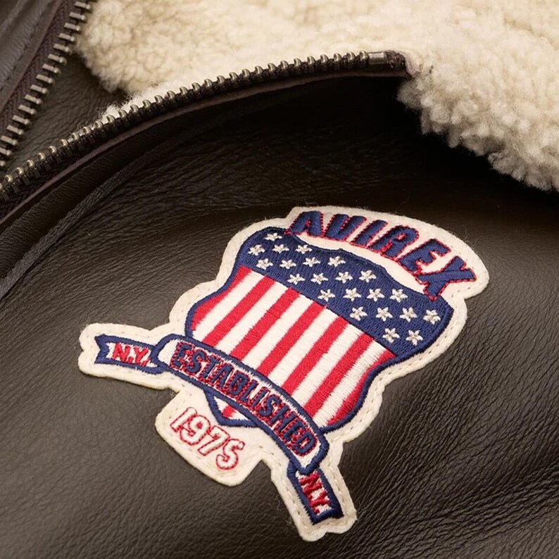 Detailed back embroidery on vintage aviator bomber leather coat