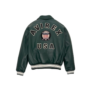 Side angle view of men’s sky blue genuine leather bomber jacket with ribbed striped cuffs and premium varsity style design