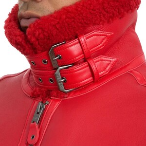 Detailed USA embroidered back patch on red B3 shearling aviator jacket