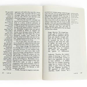 May include: Open book with text on two facing pages. The text is in black font and appears to be a historical or philosophical work. The pages are yellowed, suggesting age. The book is open, ready to be read.