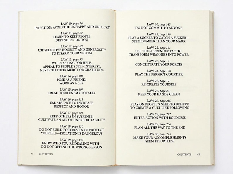 May include: Open book with text on the pages. The left page lists laws with page numbers, such as "Law 10, page 76: Infection: Avoid the Unhappy and Unlucky." The right page continues with more laws.
