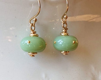 Matching earrings to glass chrysalis with 24k gold dots