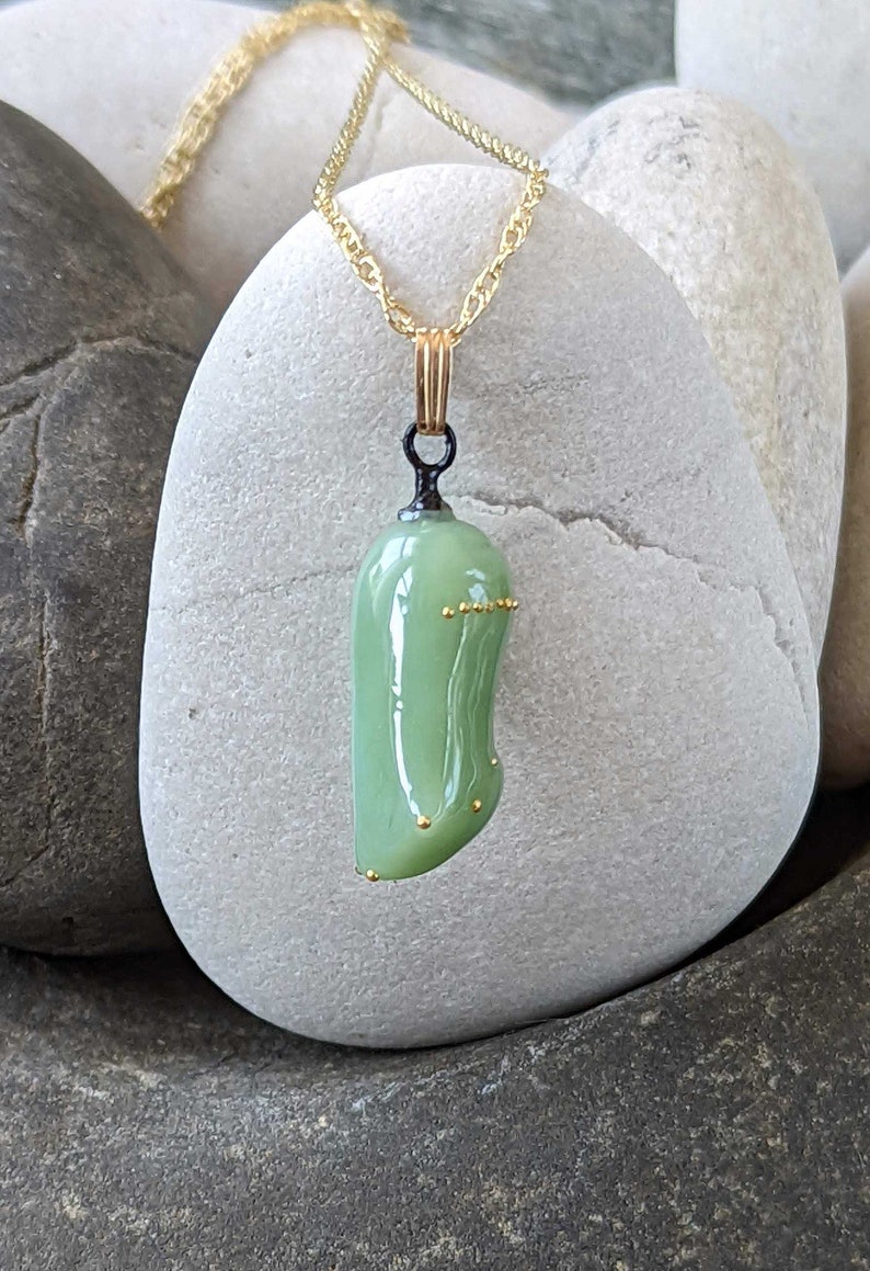 Monarch chrysalis glass necklace with 24k gold dots made by artist Jude Rose. www.juderose.com