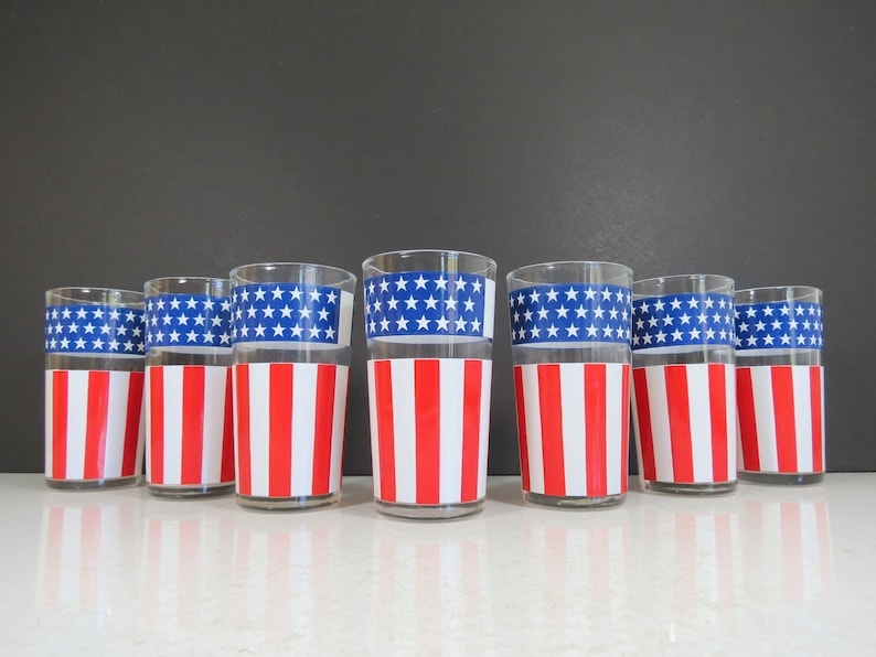 Vintage American Flag tumblers glass set. Come be inspired by 4th of July Tablescapes, Patriotic Decor & USA Finds: Happy Birthday, America in case you're in the mood for American flag and red, white, and blue festive finds.