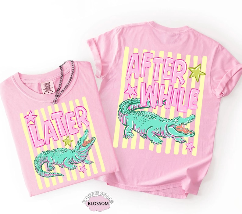May include: Two pink t-shirts with the words "LATER" and "AFTER WHILE" in pink bubble letters. Each shirt features a teal alligator graphic with an open mouth, set against yellow stripes and stars. The shirts are Comfort Colors brand.