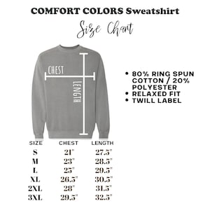 May include: A size chart for a Comfort Colors sweatshirt. The chart shows chest and length measurements in inches for sizes S through 3XL. The sweatshirt is gray and features a relaxed fit, 80% ring spun cotton, 20% polyester, and a twill label.