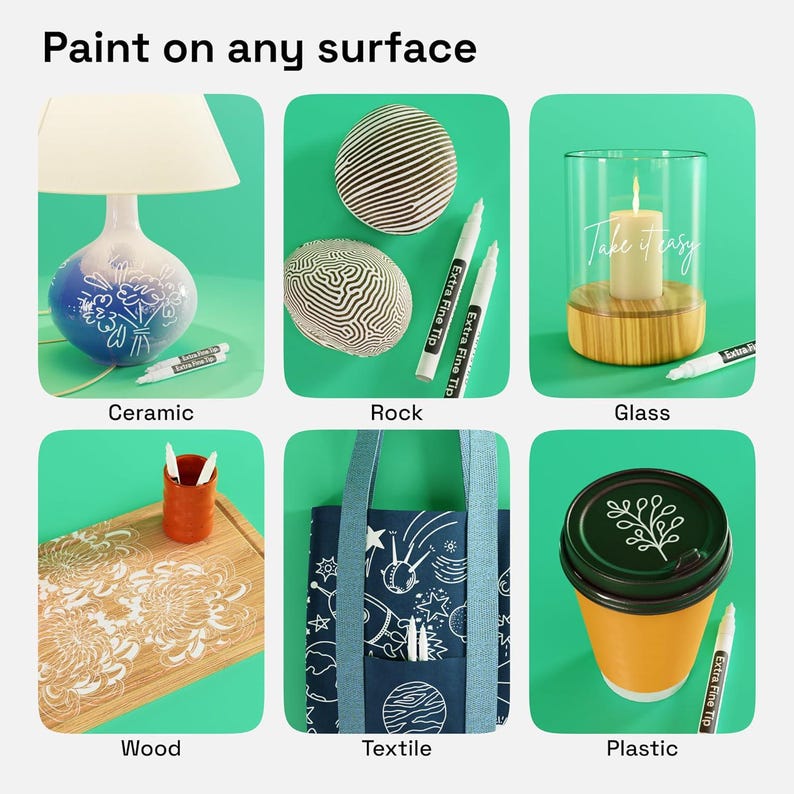 May include: A set of white extra fine tip paint markers shown decorating various surfaces including a ceramic lamp, rocks, a glass candle holder with the text Take it easy, a wooden cutting board, a blue textile tote bag, and a plastic cup lid.