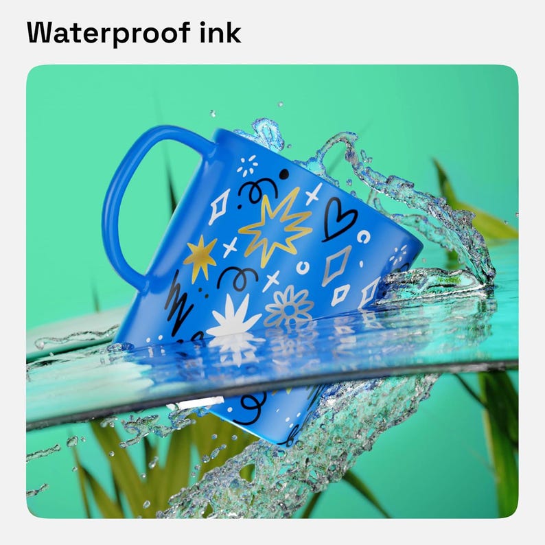 May include: A blue mug featuring a pattern of gold, white, and black stars, hearts, and swirls, partially submerged in water with splashing droplets. The text Waterproof ink is displayed above the mug, which has a curved handle.