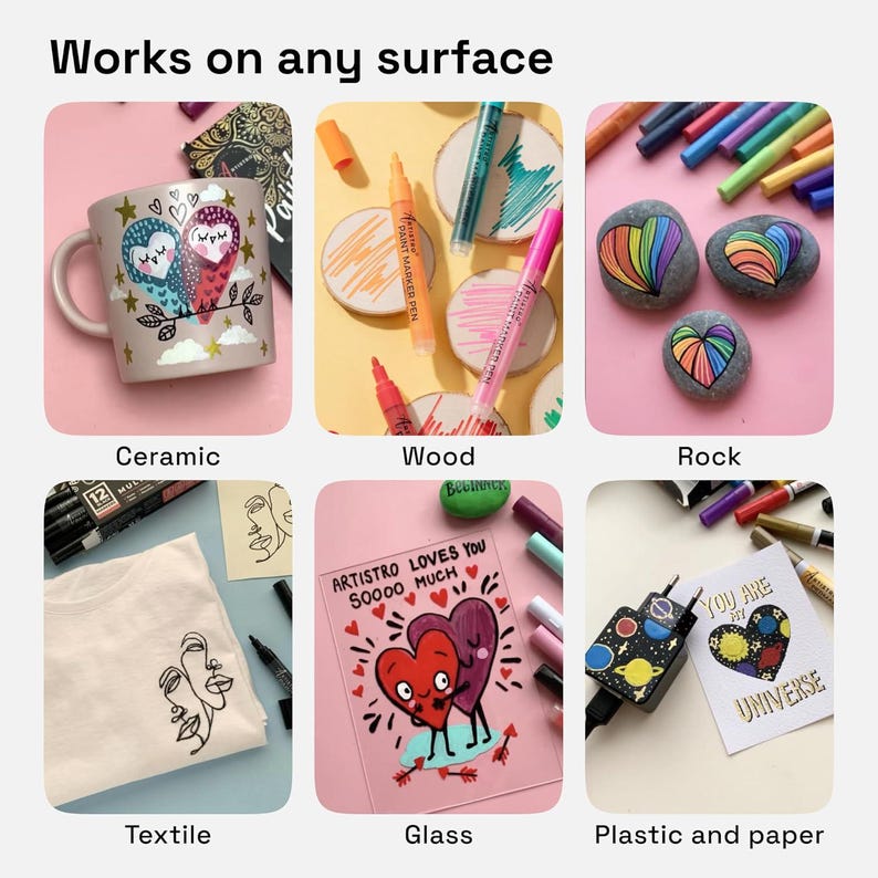 May include: Image showcasing various art projects on different surfaces, including ceramic mugs, wood coasters, rocks, textile, glass, and plastic. The text "Works on any surface" is at the top. Each surface features colorful artwork created with paint markers.