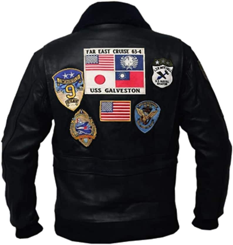 May include: Black leather jacket with a dark blue fur collar. The back of the jacket features multiple patches, including flags and military insignia. The text "FAR EAST CRUISE 63-4" and "USS GALVESTON" are visible on the patches.