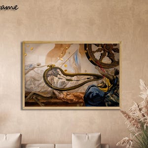 May include: A rectangular wall art print featuring a surrealist painting with a distorted melting clock, a large dark wheel, and draped figures in shades of blue, gold, and brown. The artwork is encased in a light-colored oak frame.