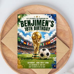 May include: A rectangular birthday invitation card featuring a gold trophy and a soccer ball on a green field inside a stadium. The text reads: LET'S CELEBRATE LIKE CHAMPIONS FOR BENJIMEN'S 18TH BIRTHDAY, SATURDAY, JUNE 18TH | 6PM, 123 ANYWHERE ST, ANY CITY, RSVP TO DAVID AT 123 123 4567.