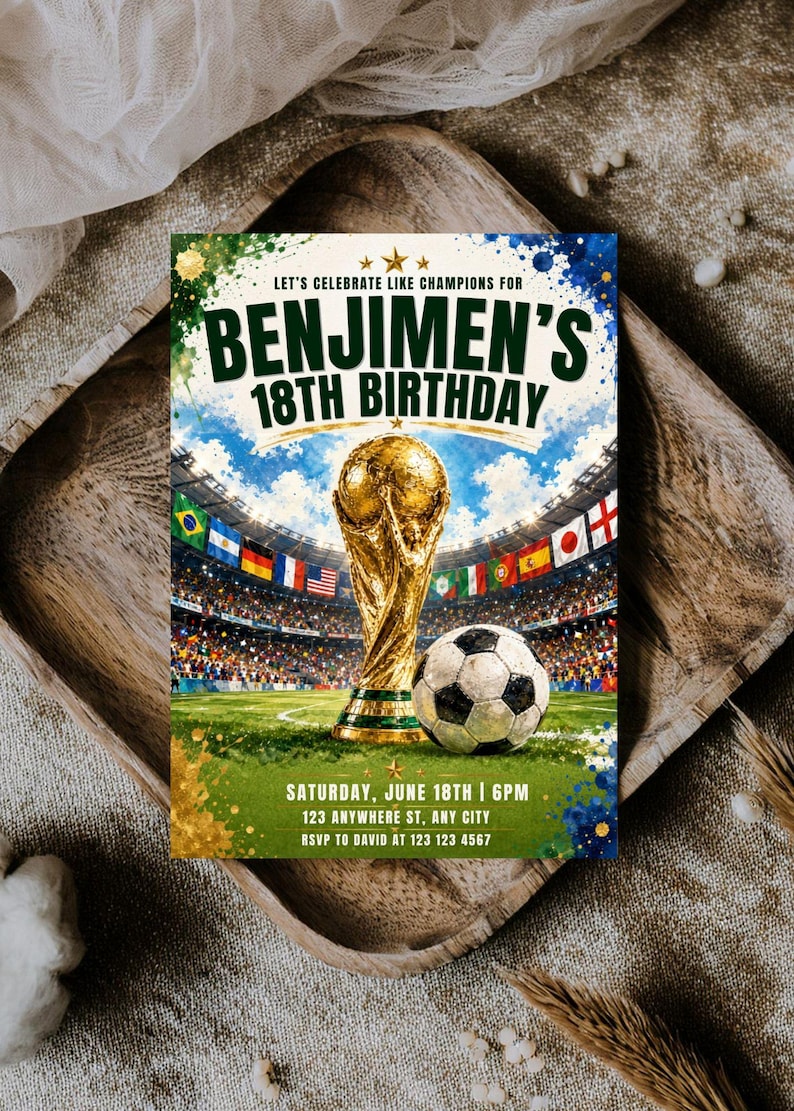 May include: A rectangular birthday invitation card featuring a gold trophy and a soccer ball on a green field inside a stadium. The text reads: LET'S CELEBRATE LIKE CHAMPIONS FOR BENJIMEN'S 18TH BIRTHDAY, SATURDAY, JUNE 18TH | 6PM, 123 ANYWHERE ST, ANY CITY, RSVP TO DAVID AT 123 123 4567.