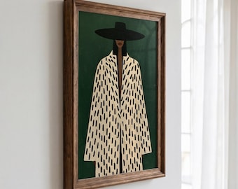 Peut inclure: Une impression d'art encadrée représentant une silhouette portant un chapeau noir à larges bords et un long manteau crème orné d'un motif répétitif de traits noirs verticaux, sur un fond vert foncé uni dans un cadre en bois.