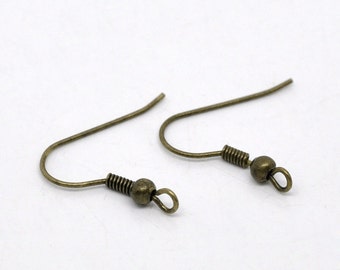 May include: Two antique gold-toned earring hooks with a spring-loaded closure. The hooks are made of metal and have a smooth, rounded finish.