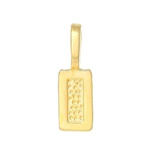 May include: Gold-toned metal pendant with a rectangular shape and a textured surface. The pendant has a loop at the top for attaching to a chain or cord.