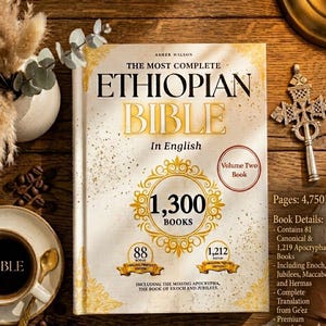 May include: A hardcover book titled "The Most Complete Ethiopian Bible" in English. The book is open, displaying the title in large gold lettering. The cover features decorative gold accents and the text "1,300 Books". A cup of coffee and a decorative cross are also visible.