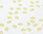 litterfall in husk on pure white organic cotton handprinted fabric panel