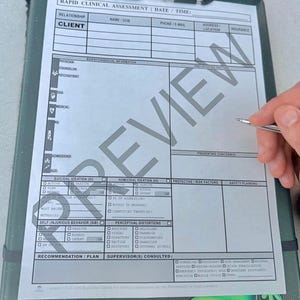 May include: A clipboard with a Rapid Clinical Assessment form. The form includes sections for client information, suicidal ideation, homicidal ideation, and safety planning. A pen is held over the form, ready to write.
