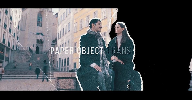 May include: A vintage-style image with the text "PAPER OBJECT TRANSITION". A man and a woman are seated outdoors, with a city backdrop. The man wears a dark coat and scarf, the woman a dark coat. The image has a distressed, aged effect.