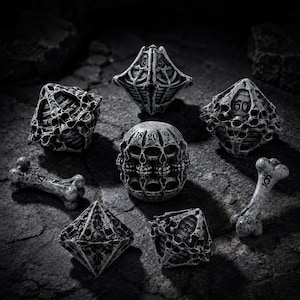 May include: A collection of fantasy-themed dice and bone-shaped game pieces. The dice are gray and intricately designed with skull and skeletal patterns. The bone pieces have numbers etched on them, and the overall aesthetic is dark and gothic.