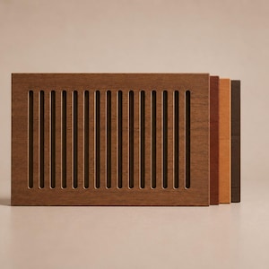 May include: A wooden vent cover with vertical slots, presented with three wood samples in shades of brown, orange, and dark brown. The vent cover is the main subject, highlighting its design and texture.