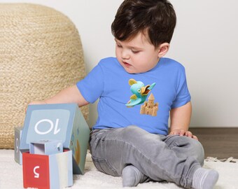 Camiseta infantil con diseño de pato y pez, apta para personas con sensibilidad sensorial • Algodón suave con estampado de castillo de arena en la playa