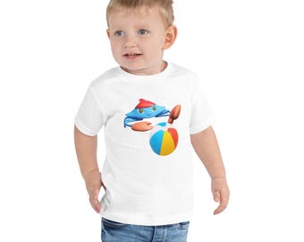 Camiseta infantil de algodón suave con estampado de cangrejo y pelota de playa, apta para niños con sensibilidad sensorial (sin etiqueta).