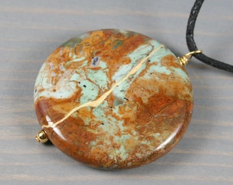 Kintsugi repaired green "opal" (chalcedony) pendant on an adjustable length black cotton cord necklace