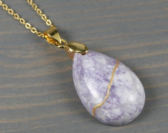 Kintsugi repaired purple turquoise teardrop pendant on a cable chain necklace