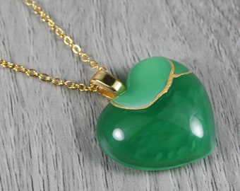 Broken heart pendant in green agate with kintsugi repair on a cable chain necklace