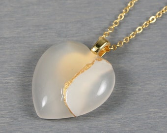 Broken heart pendant in white agate with kintsugi repair on a cable chain necklace