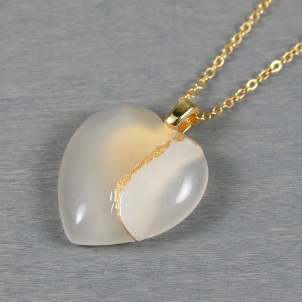 Broken heart pendant in white agate with kintsugi repair on a cable chain necklace