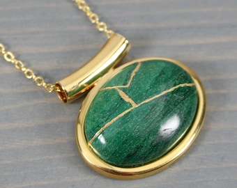 Kintsugi repaired African jade pendant in a gold plated setting on a cable chain necklace
