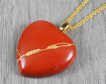 Kintsugi repaired red jasper broken heart pendant on a rope chain necklace