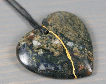 Kintsugi repaired pietersite broken heart pendant on an black cotton cord necklace