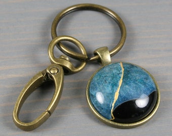 Kintsugi repaired black and teal druzy agate key chain with an antiqued brass swivel lobster claw