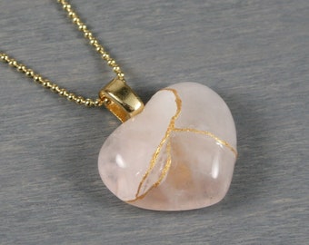 Petite rose quartz broken heart pendant with kintsugi repair on a ball chain necklace