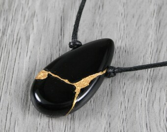 Kintsugi repaired petite sardonyx teardrop pendant on a black cotton cord necklace