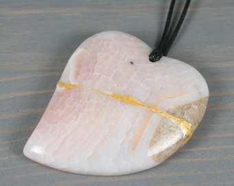 Kintsugi repaired white dragon veins agate broken heart pendant on an adjustable length black cotton cord necklace