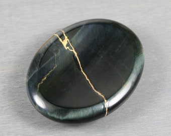 Kintsugi repaired blue tiger eye worry stone