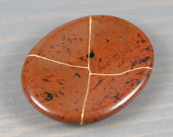 Kintsugi repaired mahogany obsidian worry stone