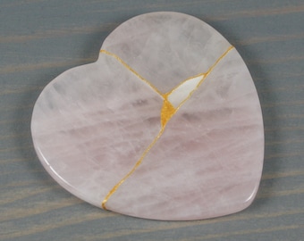 Kintsugi repaired rose quartz heart paperweight