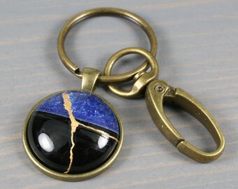 Kintsugi repaired black and blue druzy agate key chain with an antiqued brass swivel lobster claw