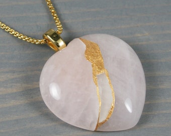 Large rose quartz broken heart pendant with kintsugi repair on chain necklace