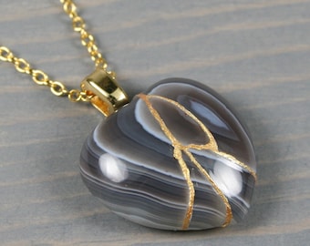 Broken heart pendant in botswana agate with kintsugi repair on cable chain necklace