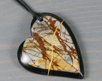 Kintsugi repaired intarsia jasper broken heart pendant on black cotton cord