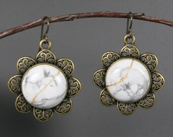 Kintsugi repaired white howlite earrings with antiqued brass flower settings and niobium ear wires