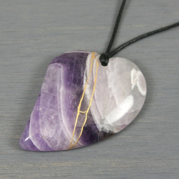 Kintsugi repaired amethyst broken heart pendant on black cotton cord